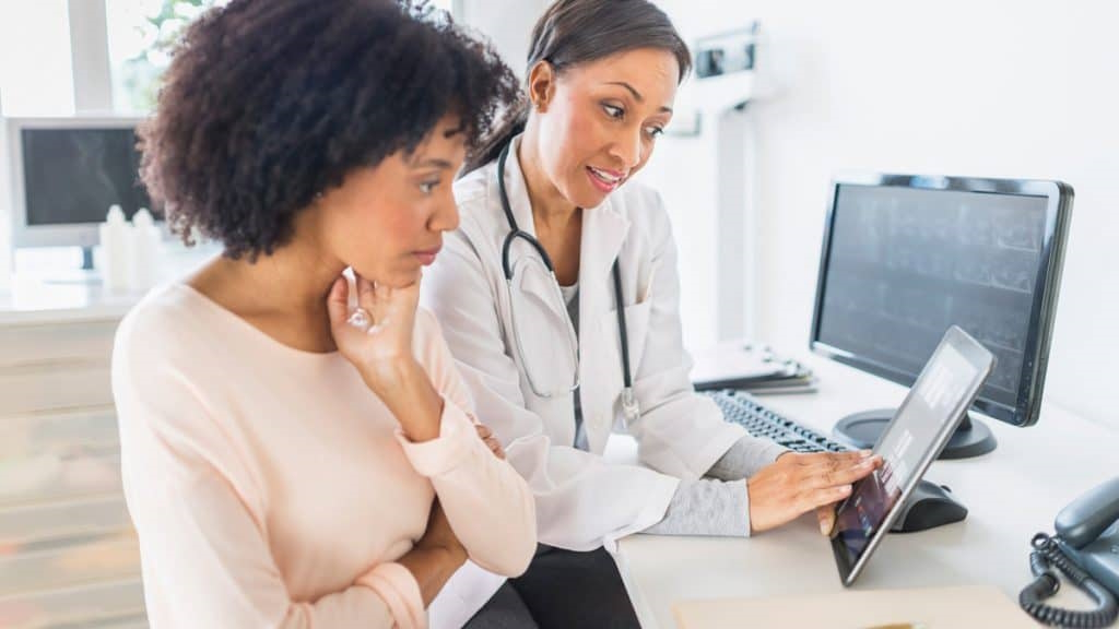 fibroid symptoms doctor consultation woman