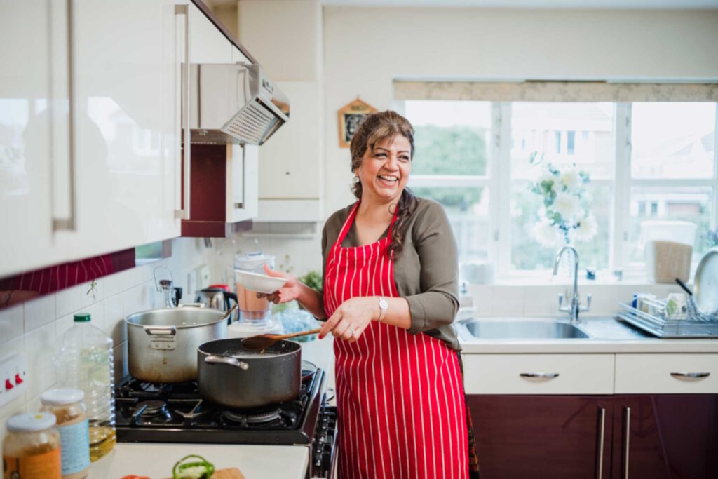 stress and fibroids woman enjoying cooking