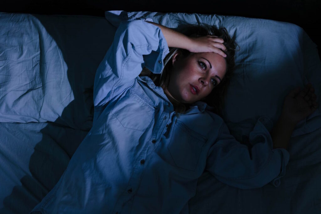 uterine fibroids woman lying on the bed awake