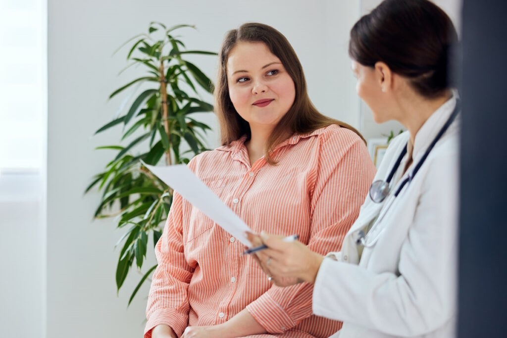 uterine fibroid embolization ufe smiling woman patient doctor visit